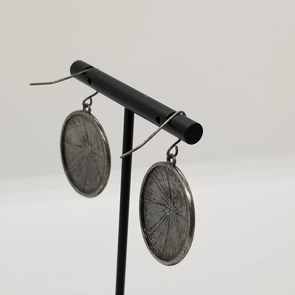silver tone starburst dangle earrings